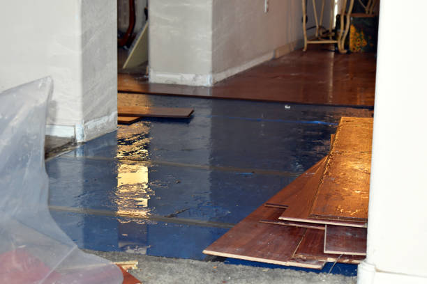 Professional Flood Damage Restoration technician working in Schofield, WI